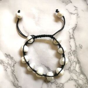 Pearl bracelet on adjustable black silk cord